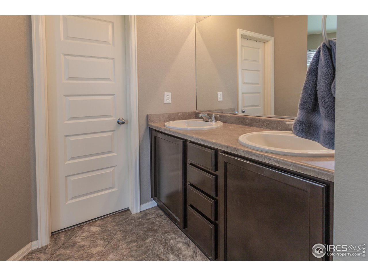 8594 Raspberry Drive Frederick, CO 80504 - Photo 25 of 40 a bathroom with a sink and a mirror