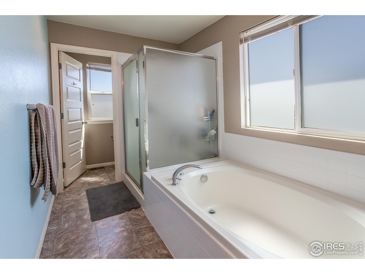8594 Raspberry Drive Frederick, CO 80504 - Photo 26 of 40 a bathroom with a bathtub and a shower