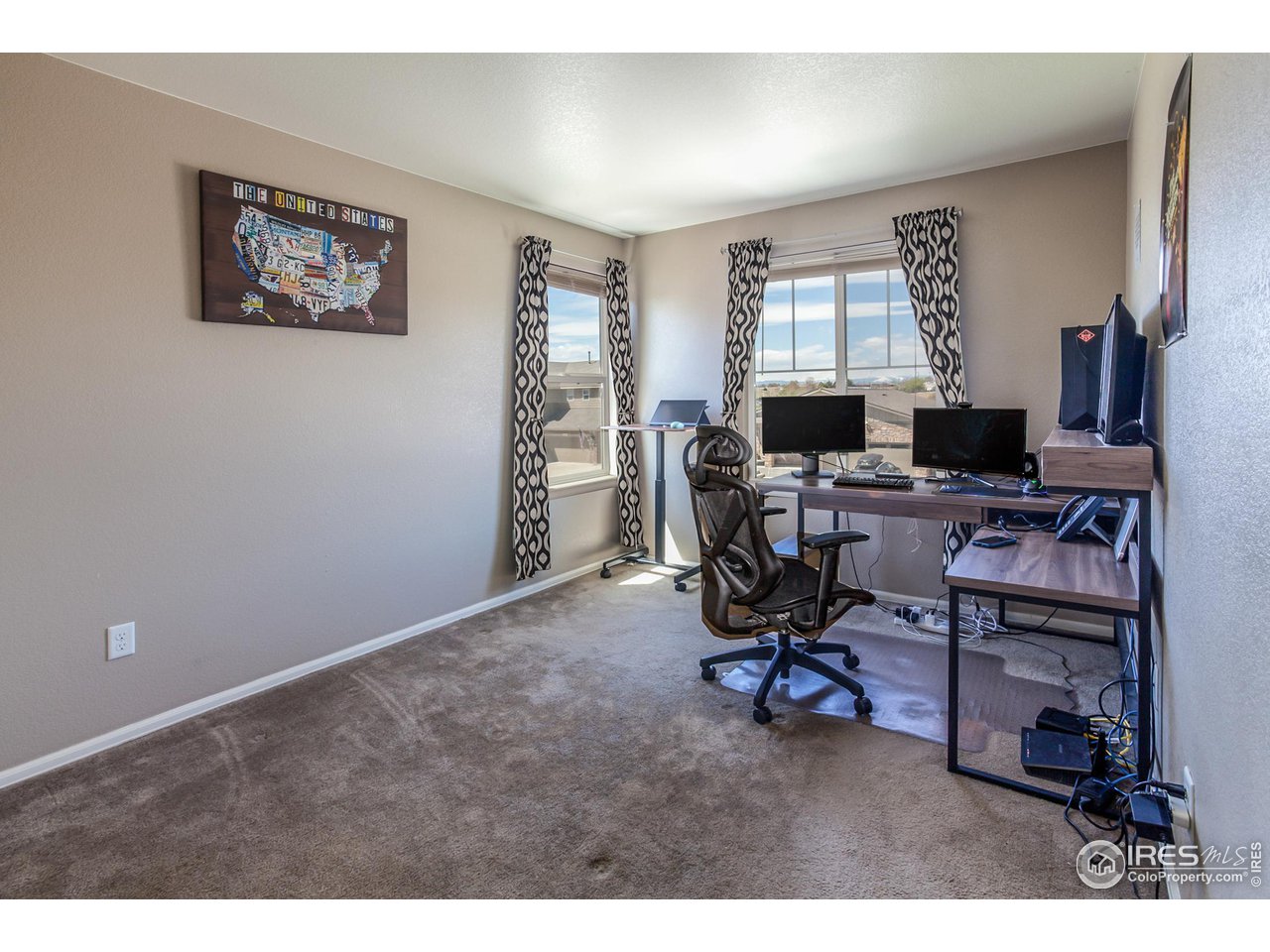 8594 Raspberry Drive Frederick, CO 80504 - Photo 30 of 40 a view of a workspace with furniture and a window