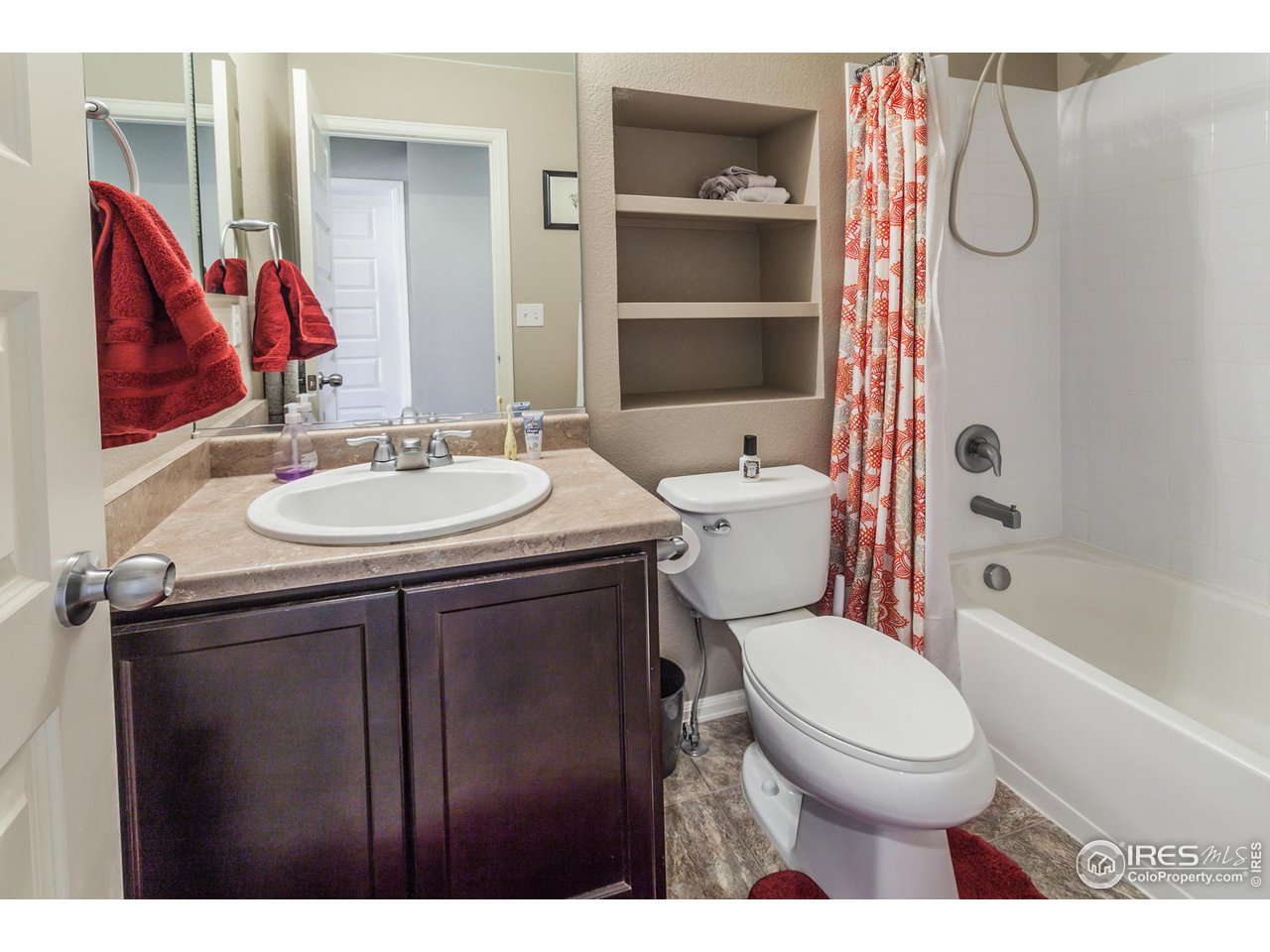 8594 Raspberry Drive Frederick, CO 80504 - Photo 31 of 40 a bathroom with a sink toilet and shower