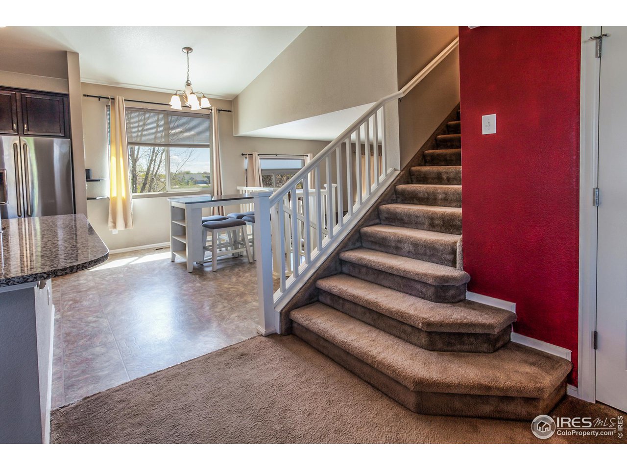 8594 Raspberry Drive Frederick, CO 80504 - Photo 4 of 40 a view of entryway and hall with wooden floor