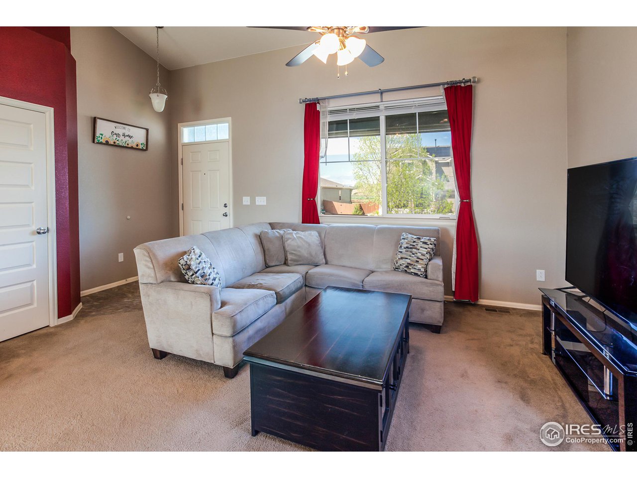 8594 Raspberry Drive Frederick, CO 80504 - Photo 5 of 40 a living room with furniture and a flat screen tv