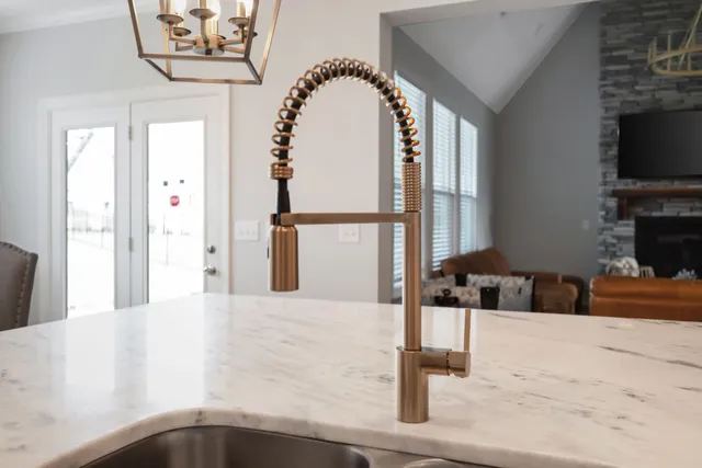 a bathroom with a bathtub a sink and a large mirror