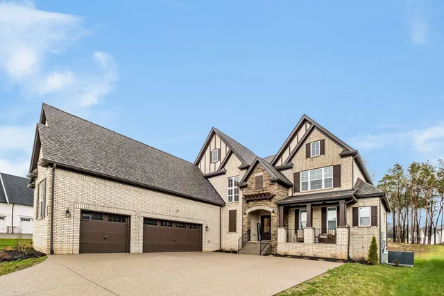 a front view of a house with yard