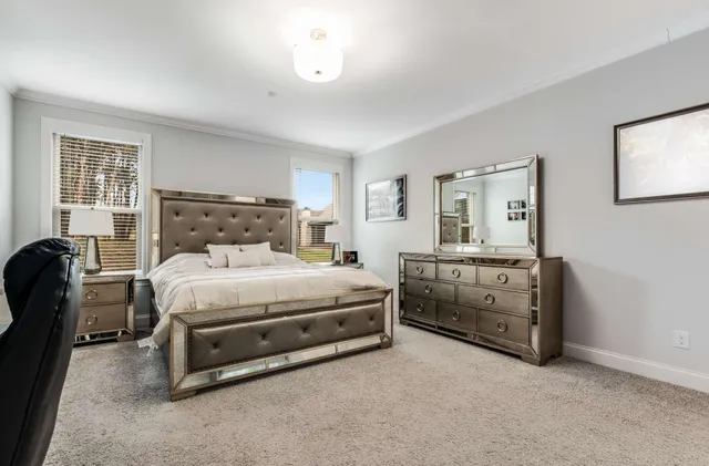 a outdoor living space with furniture and flat screen tv