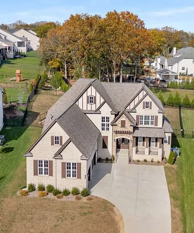 a view of a livingroom with furniture and a floor to ceiling window