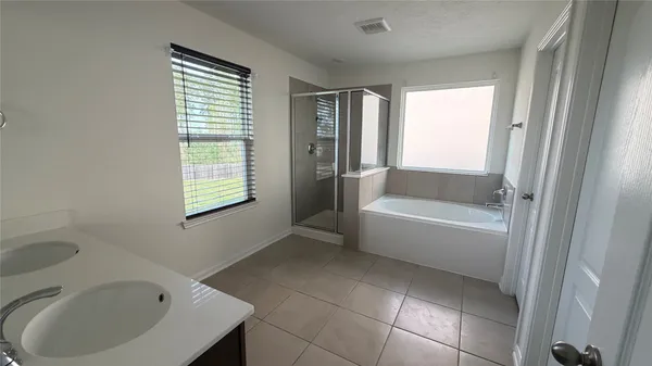 a bathroom with a bathtub and a sink