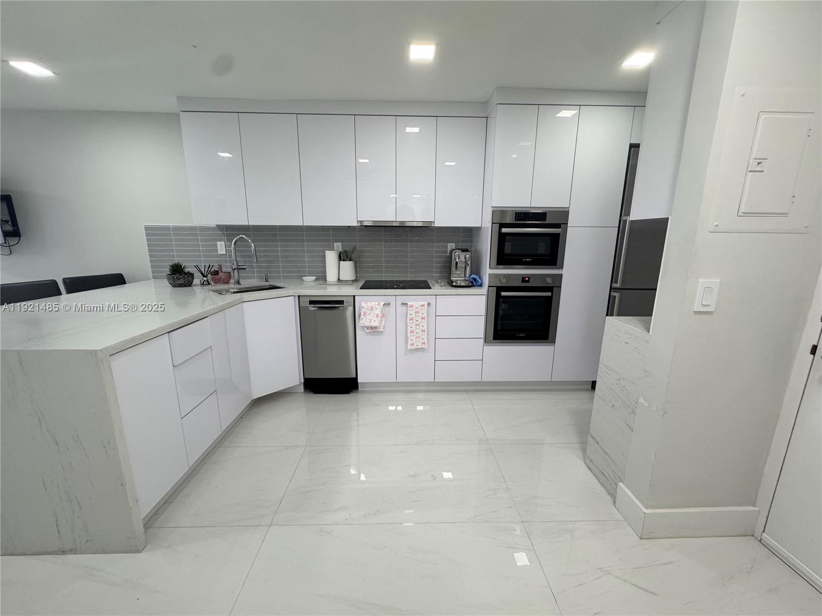 a kitchen with a sink a stove and refrigerator