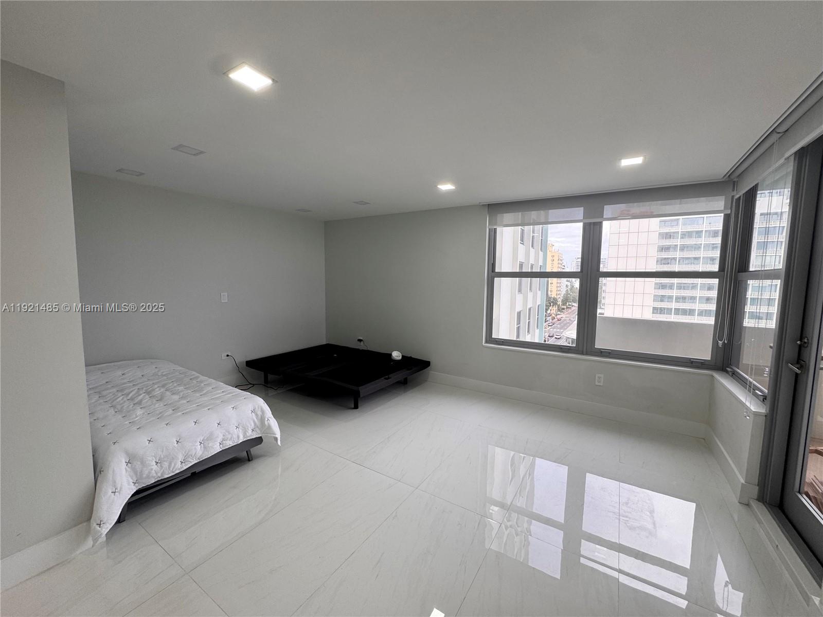 2899 Collins Avenue, Unit 915 Miami Beach, FL 33140 - Photo 5 of 31 a view of bedroom and window