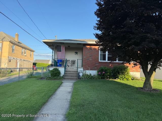 405 17th Avenue Scranton, PA 18504 - Photo 2 of 28 a front view of a house with garden