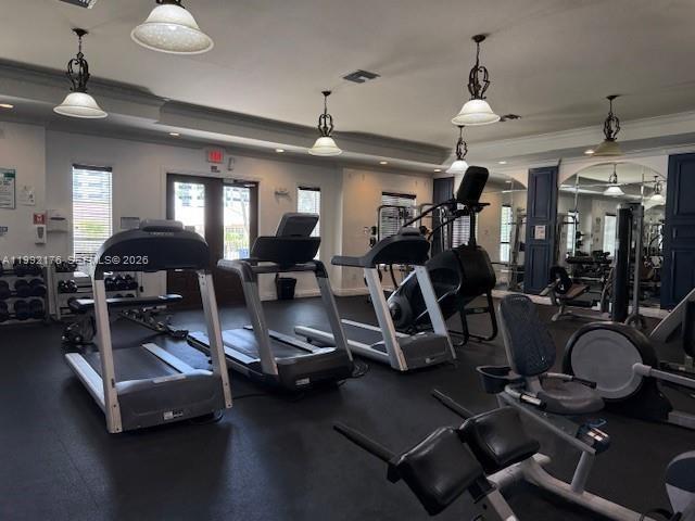 6831 Southwest 44th Street, Unit 203 Miami, FL 33155 - Photo 11 of 15 a room with gym equipment and a chandelier