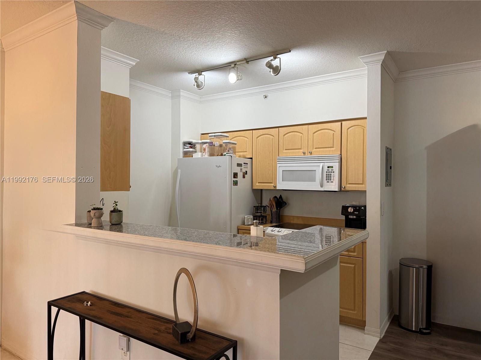 6831 Southwest 44th Street, Unit 203 Miami, FL 33155 - Photo 3 of 15 a bathroom with a sink and a mirror