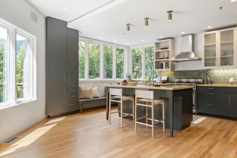 a kitchen with a table and chairs
