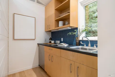 a kitchen with stainless steel appliances a sink and a window