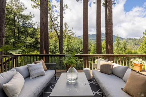 a balcony with furniture and city view