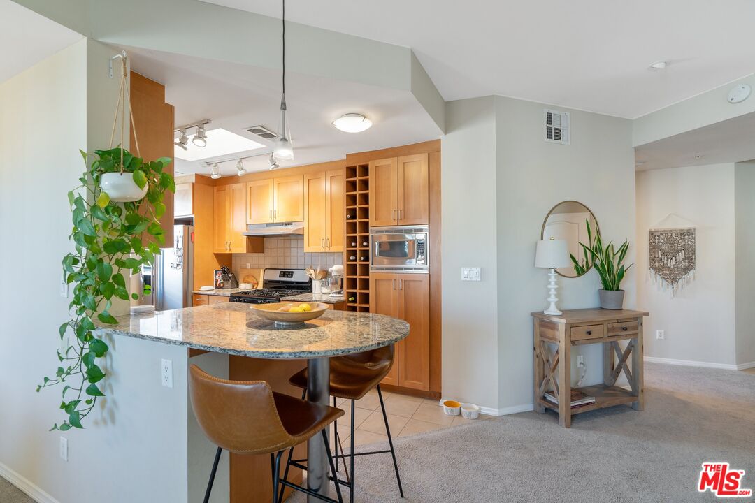 4170 Fair Avenue, Unit PH2 Studio City, CA 91602 - Photo 12 of 42 a view of a dining room with furniture window and outside view