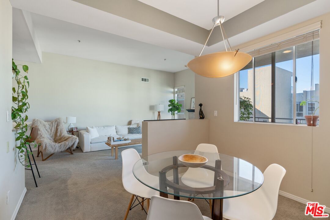 4170 Fair Avenue, Unit PH2 Studio City, CA 91602 - Photo 14 of 42 a dining room with furniture and window