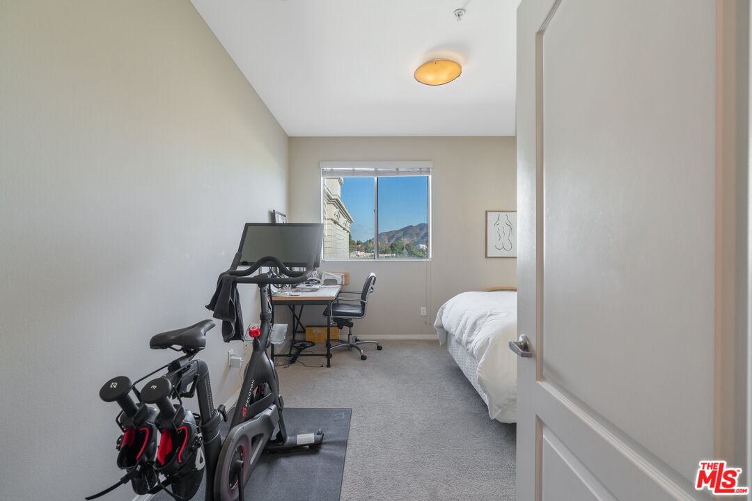 4170 Fair Avenue, Unit PH2 Studio City, CA 91602 - Photo 24 of 42 a bedroom with a bed and a window