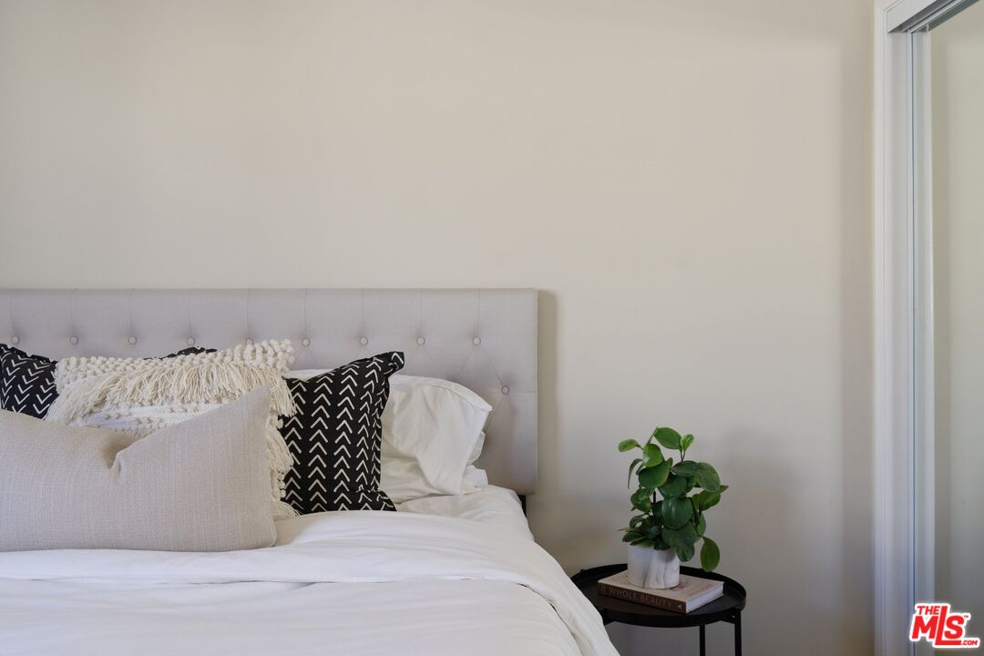 4170 Fair Avenue, Unit PH2 Studio City, CA 91602 - Photo 27 of 42 a bed sitting in a bedroom next to a white wall