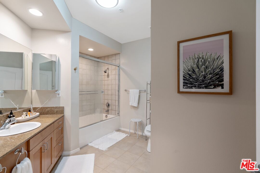 4170 Fair Avenue, Unit PH2 Studio City, CA 91602 - Photo 29 of 42 a bathroom with a double vanity sink mirror and shower