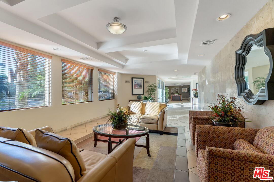 4170 Fair Avenue, Unit PH2 Studio City, CA 91602 - Photo 3 of 42 a living room with furniture and a large window