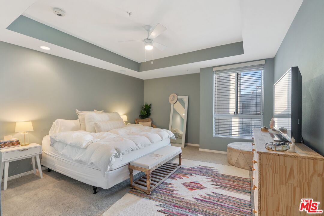 4170 Fair Avenue, Unit PH2 Studio City, CA 91602 - Photo 32 of 42 a bedroom with a bed and a flat tv screen on dresser