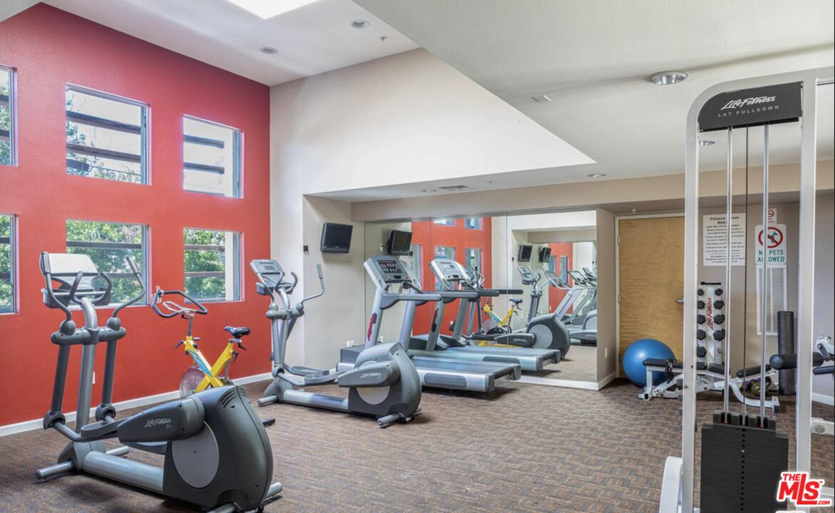 4170 Fair Avenue, Unit PH2 Studio City, CA 91602 - Photo 39 of 42 a room with gym equipment and a large window