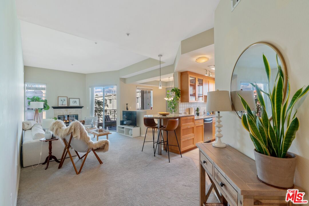 4170 Fair Avenue, Unit PH2 Studio City, CA 91602 - Photo 6 of 42 a view of a livingroom with furniture and a potted plant