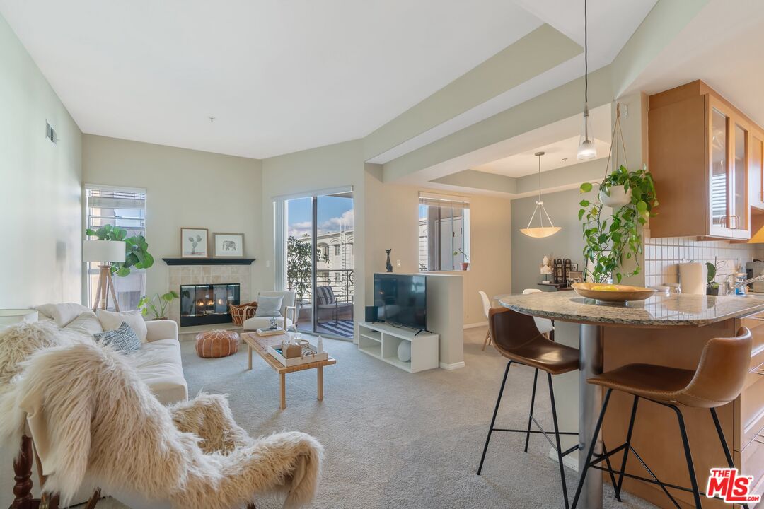 4170 Fair Avenue, Unit PH2 Studio City, CA 91602 - Photo 7 of 42 a living room with furniture and a dining table