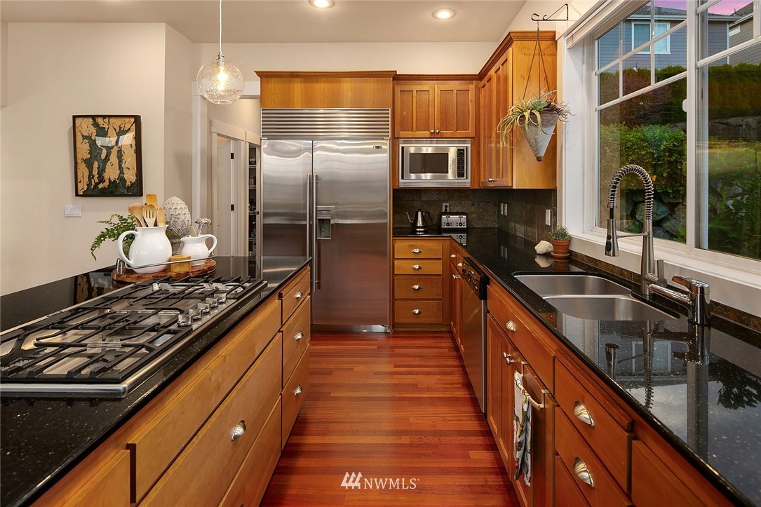 2716 Williams Avenue North Renton, WA 98056 - Photo 8 of 38 a kitchen with stainless steel appliances a sink stove and refrigerator