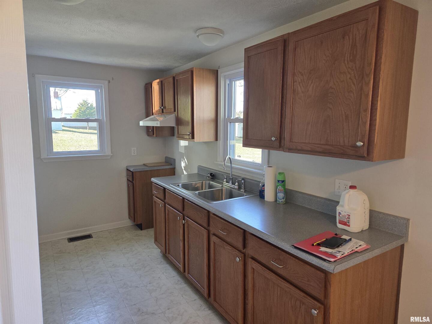 208 West Cherry Street Springerton, IL 62887 - Photo 13 of 13 a kitchen with stainless steel appliances a sink stove and cabinets