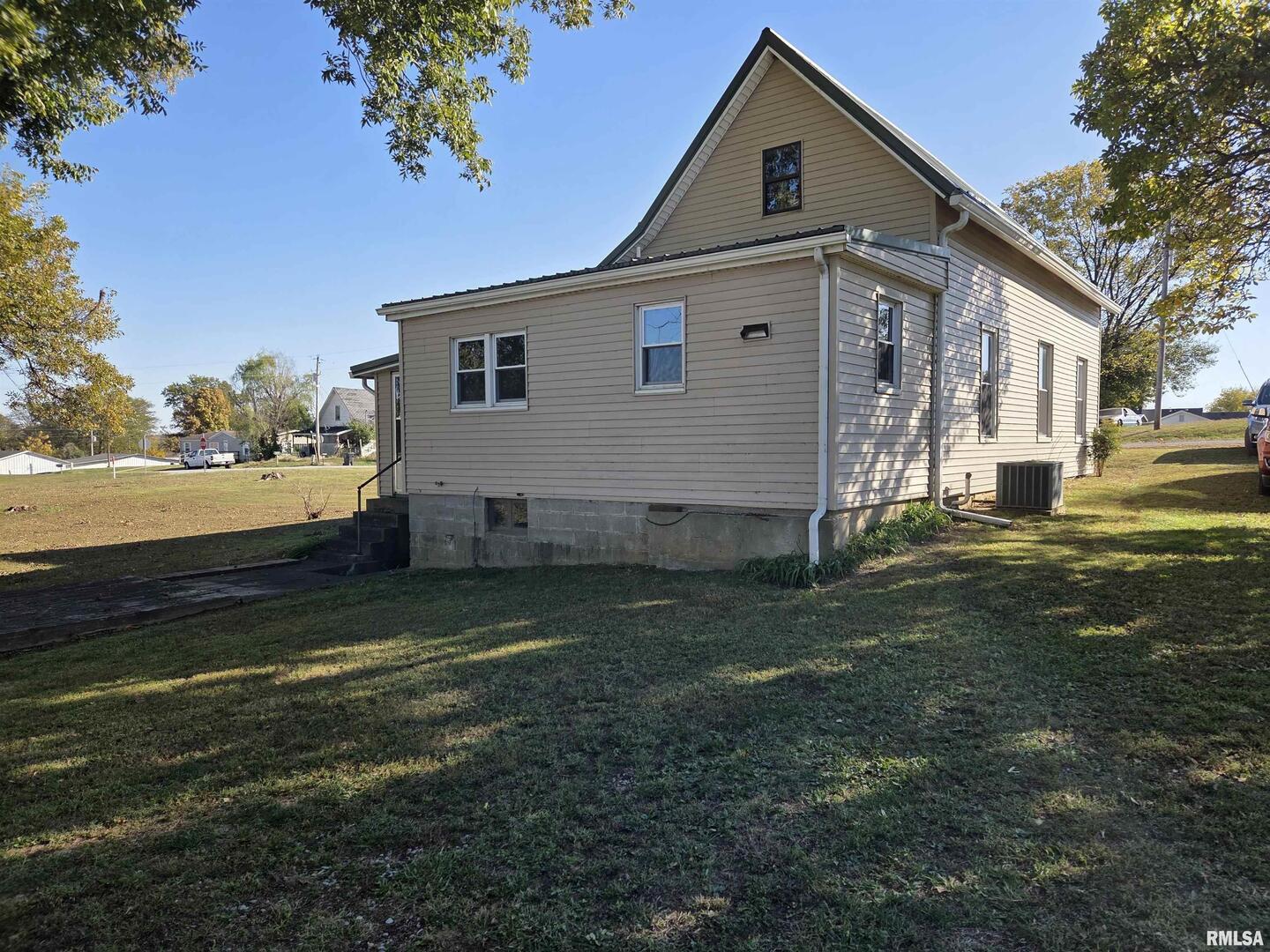 208 West Cherry Street Springerton, IL 62887 - Photo 2 of 13 a view of a house with a yard