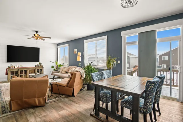 a view of a dining room with furniture window and wooden floor
