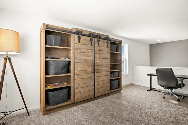 a livingroom with furniture and a gate