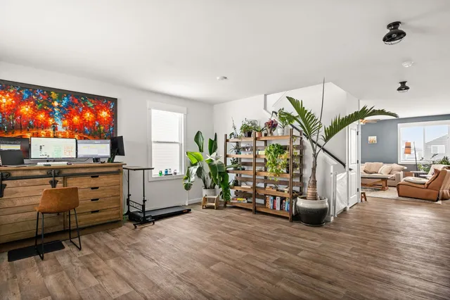 a room with furniture and a wooden floor