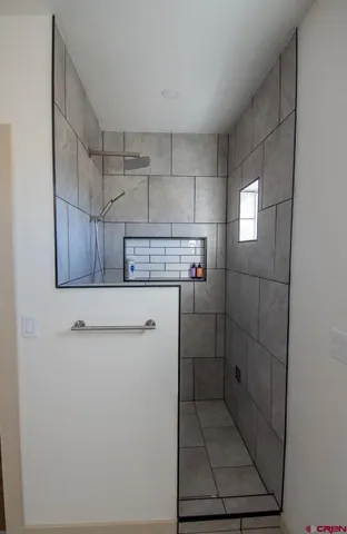 a utility room with cabinets washer and dryer