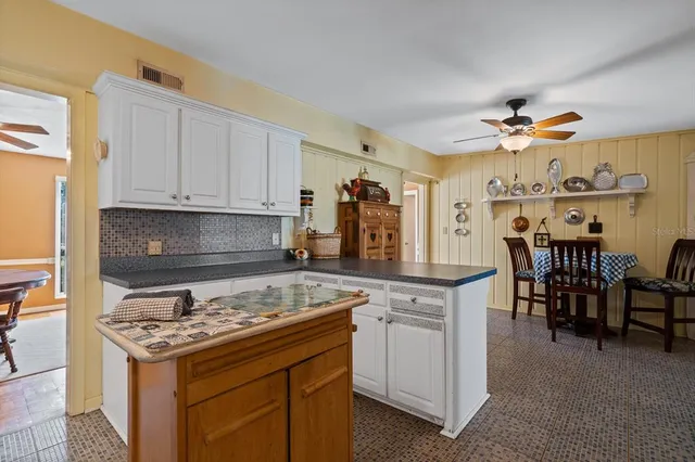 a view of a livingroom with furniture and a window