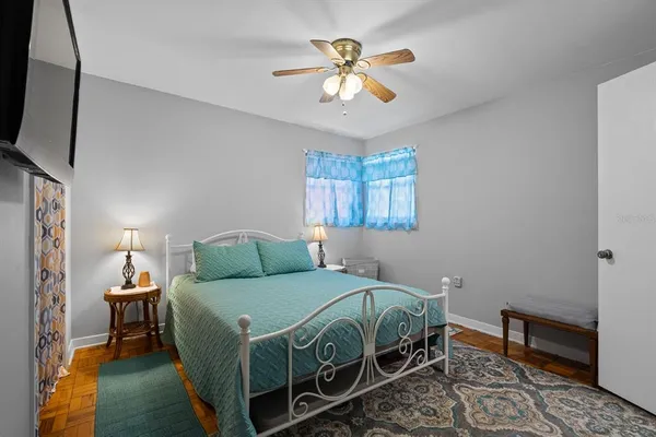 a bathroom with a toilet and a shower curtain