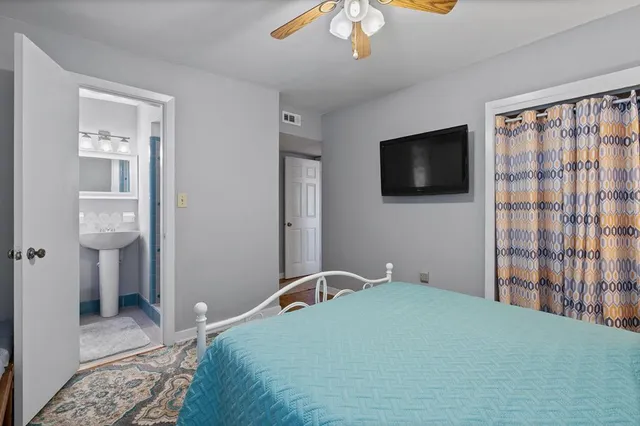 a bathroom with a sink toilet and a mirror