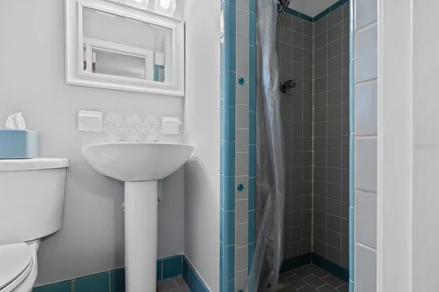 a bedroom with a bed and dresser