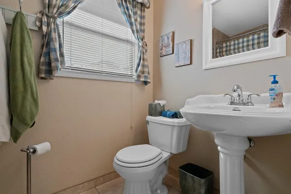a bedroom with a large bed and dresser