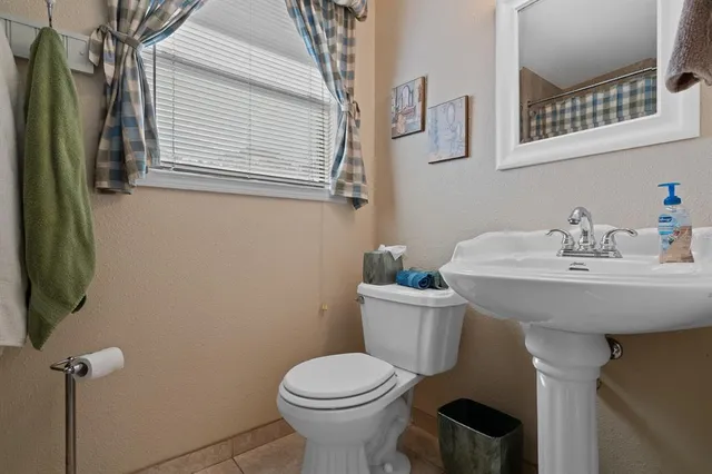 a bedroom with a large bed and dresser