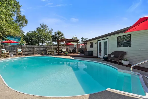 an aerial view of a backyard with outdoor seating