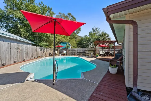 a view of park with large trees
