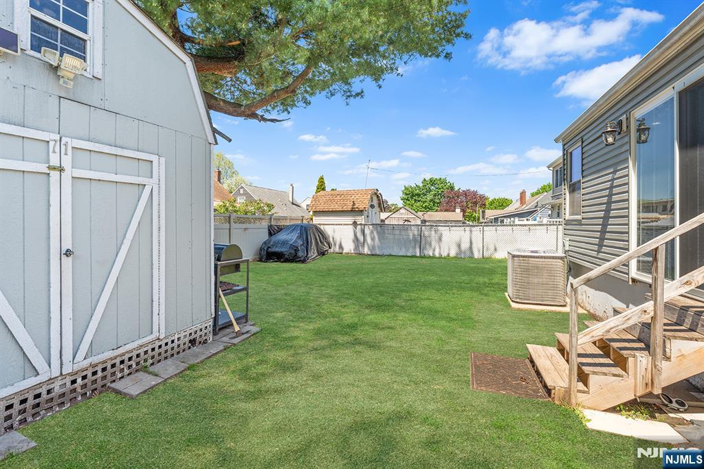 71 Wingra Avenue Rutherford, NJ 07070 - Photo 19 of 20 a view of a backyard with plants and a patio