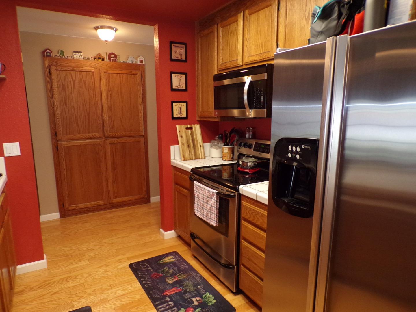 7674 Benassi Drive Gilroy, CA 95020 - Photo 11 of 16 a kitchen with stainless steel appliances granite countertop a refrigerator and a sink