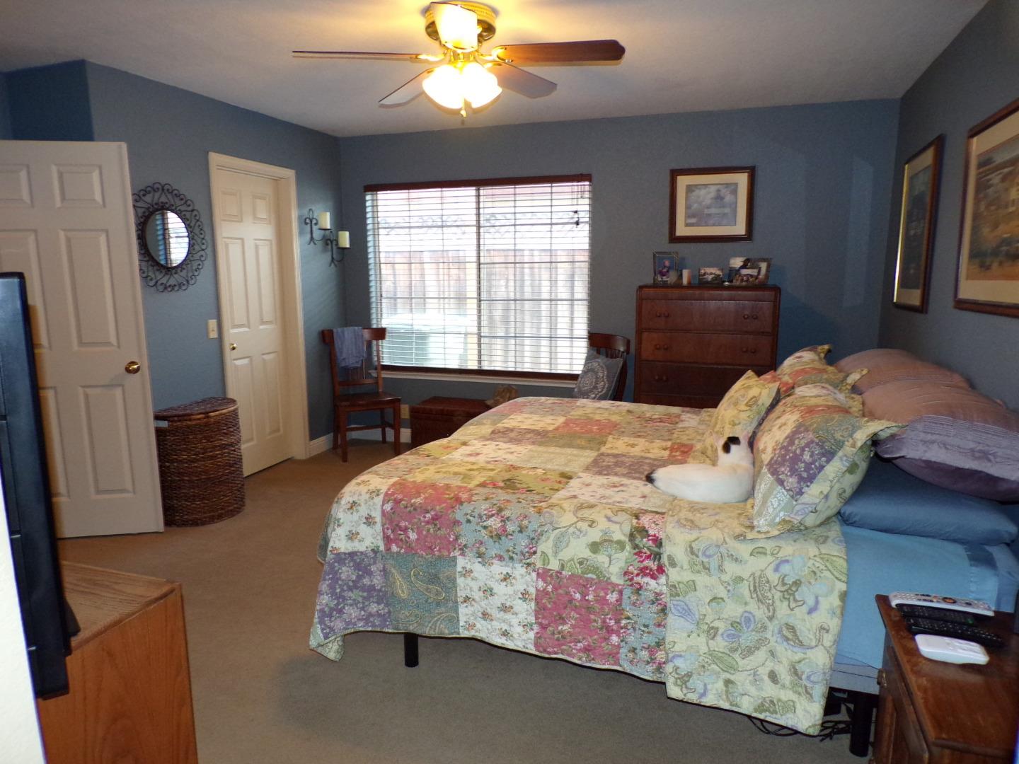 7674 Benassi Drive Gilroy, CA 95020 - Photo 14 of 16 a bedroom with a bed dresser and window