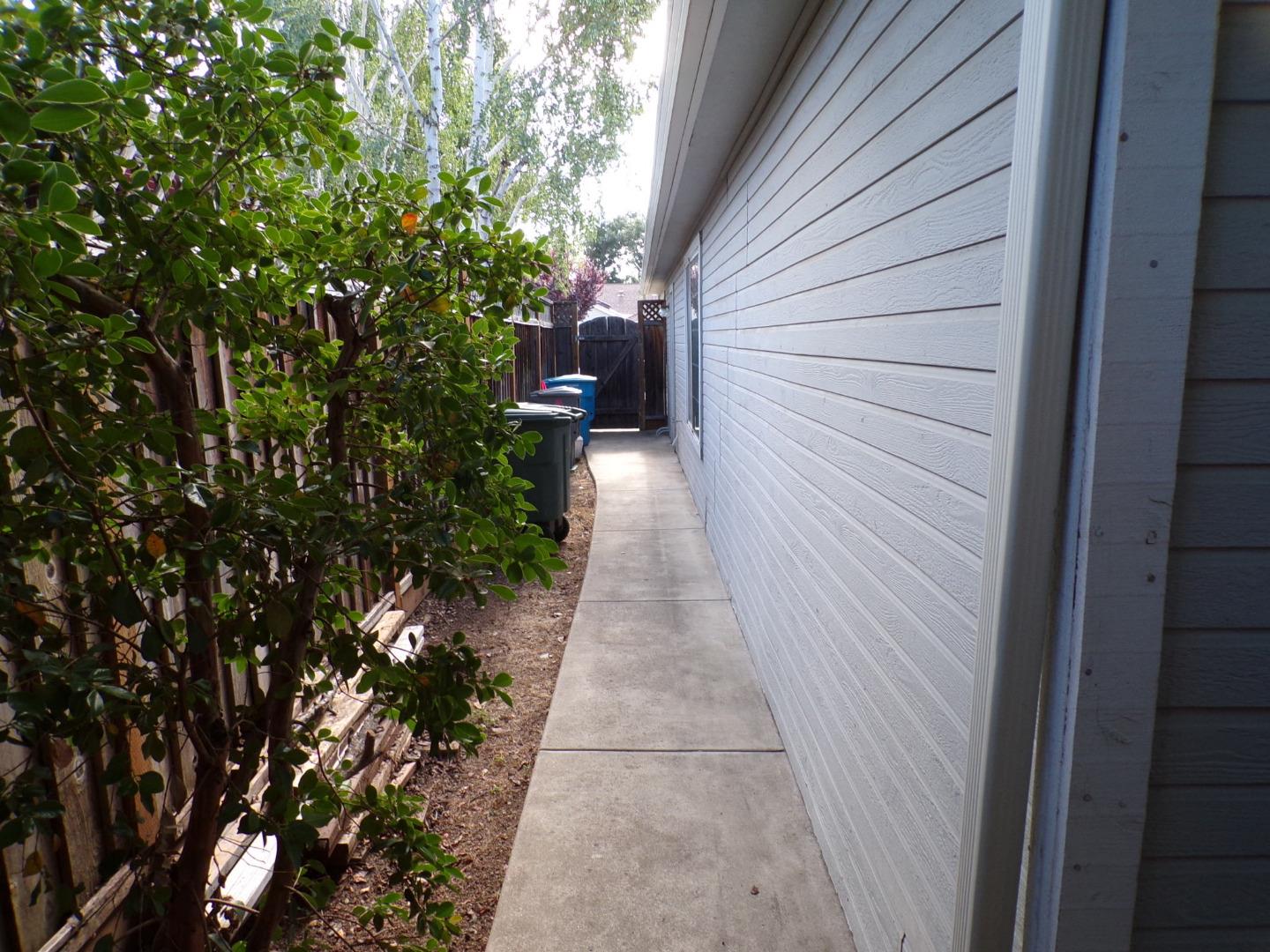7674 Benassi Drive Gilroy, CA 95020 - Photo 5 of 16 a view of a pathway both side of the house