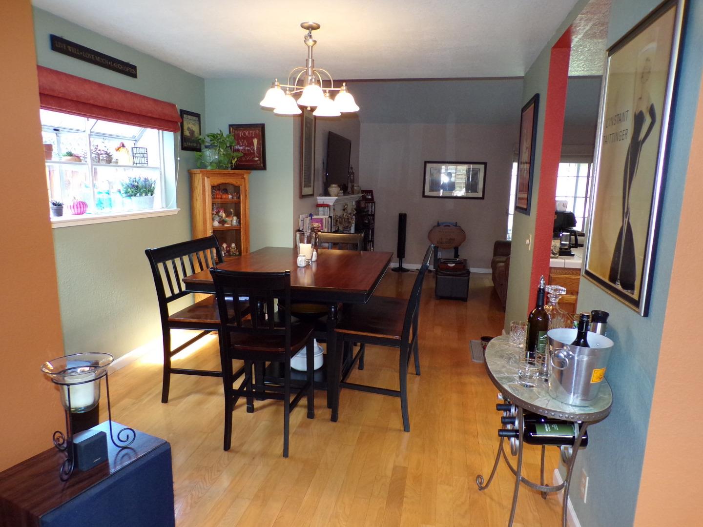 7674 Benassi Drive Gilroy, CA 95020 - Photo 9 of 16 a view of a dining room with furniture and a chandelier