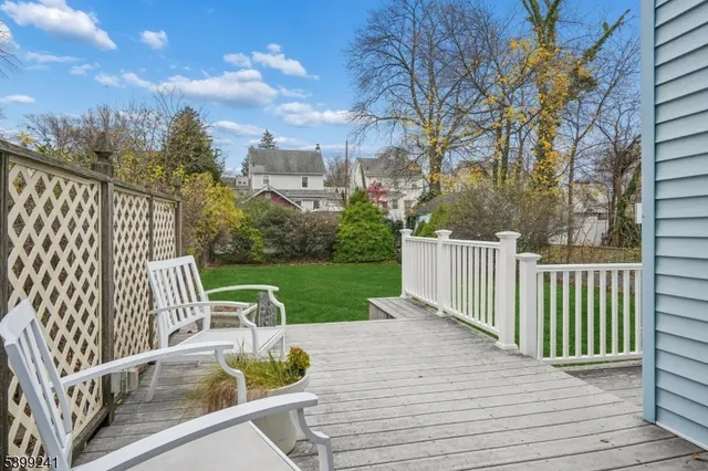 a view of a wooden deck and a patio